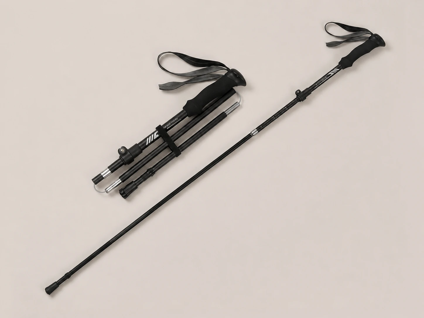 Zwarte opvouwbare Hiking Stick met polsband, uitgeklapt en ingeklapt